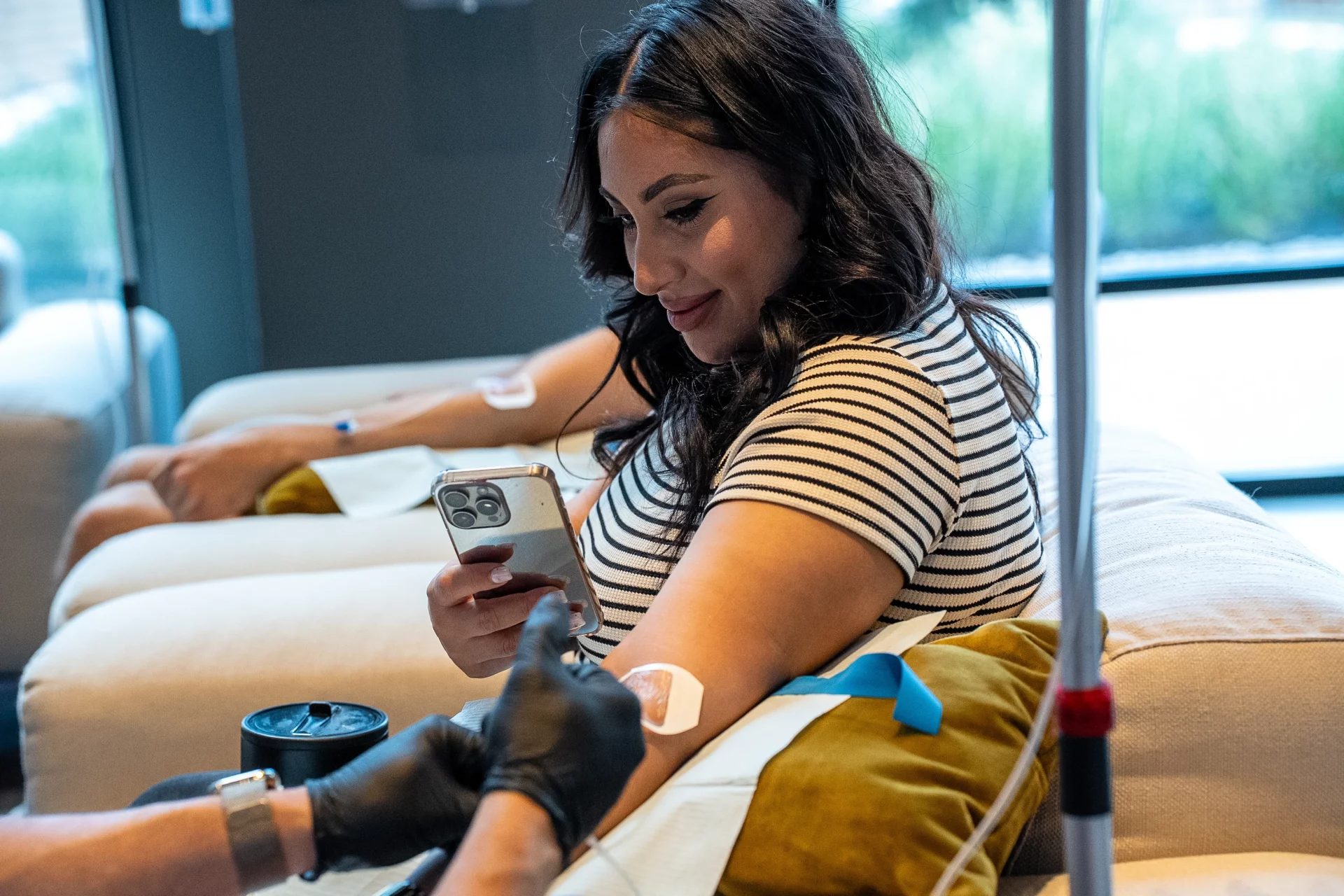 Smiling person during professional IV therapy