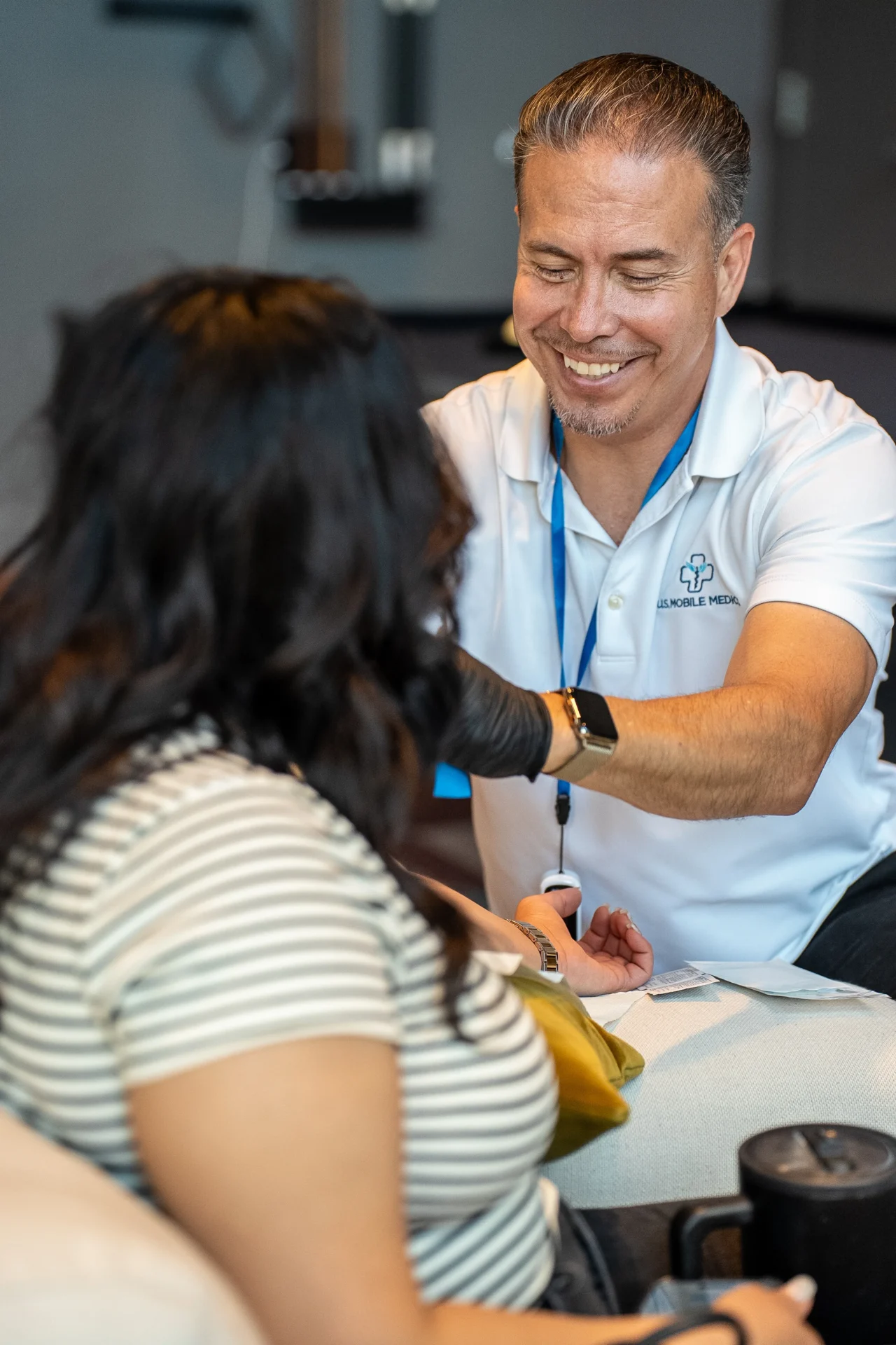 Smiling IV Team Member Speaking To Patient