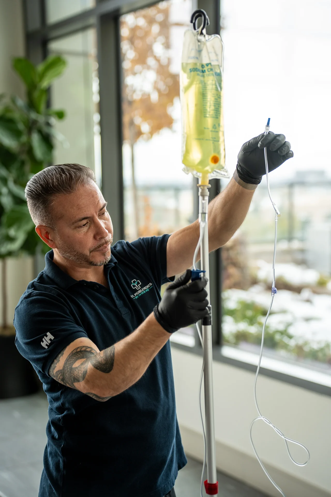 Mobile care professional preparing hydration drip