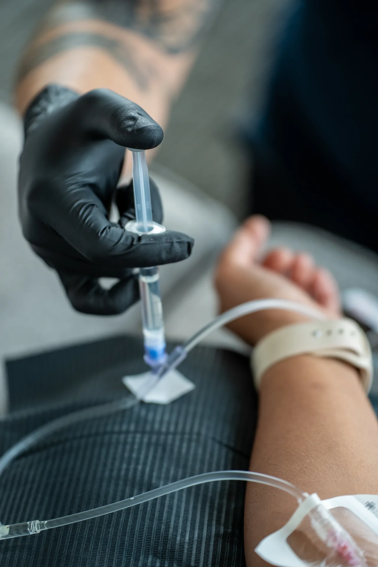 Vitamin booster being added to an IV